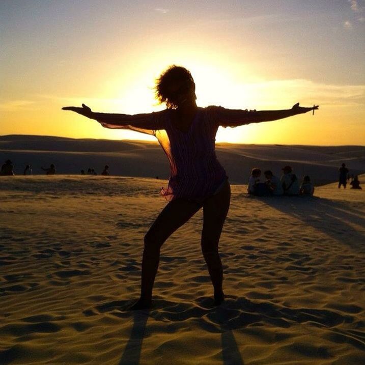 sunset, beach, sea, leisure activity, lifestyles, orange color, full length, shore, sky, sand, enjoyment, silhouette, person, fun, vacations, water, standing, horizon over water