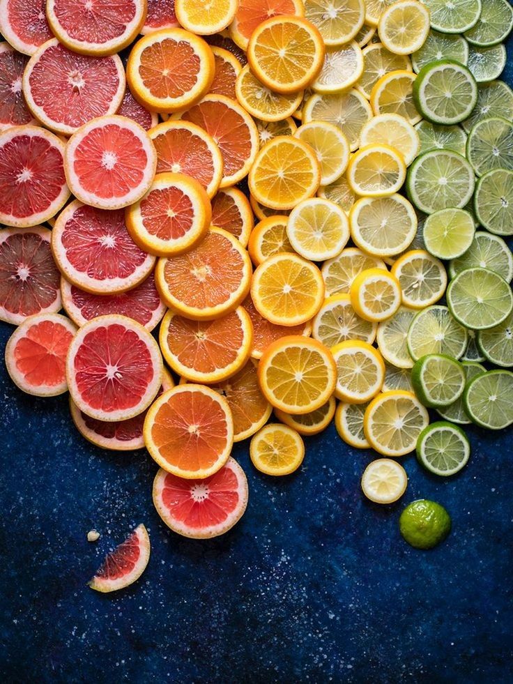 citrus fruit, fruit, slice, healthy eating, food, food and drink, produce, citrus, freshness, wellbeing, no people, large group of objects, lemon, orange, orange color, high angle view, abundance, plant, indoors, still life, directly above, cross section, lime, variation, grapefruit, close-up