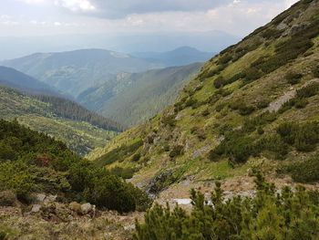 Scenic view of tree mountains against sky