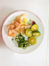 High angle view of fruits in plate on table