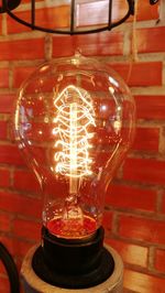 Close-up of illuminated light bulb