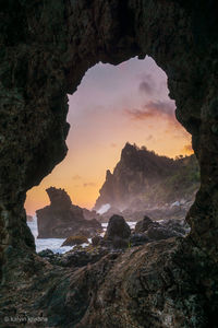 Scenic view of rock formation against sky during sunset