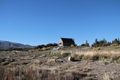 View of landscape against clear blue sky