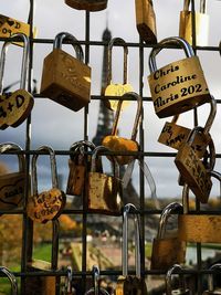 Close-up of padlocks hanging on railing