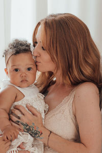 Portrait of mother with baby