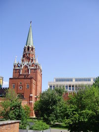 Low angle view of bell tower against blue sky