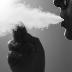 Portrait of man smoking cigarette