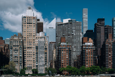 Buildings in city against sky