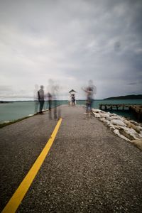 People on road against sky