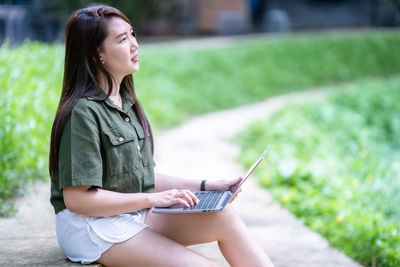 Young woman using mobile phone