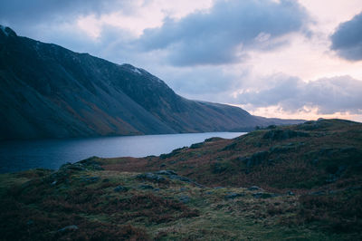 Scenic view of lake against cloudy sky