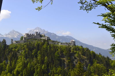 Panoramic view of trees and buildings against sky