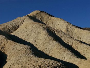 Scenic view of landscape against blue sky