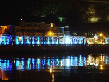 Reflection of illuminated buildings in water at night