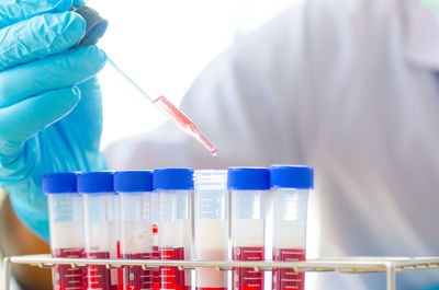 Cropped image of male scientist experimenting in laboratory