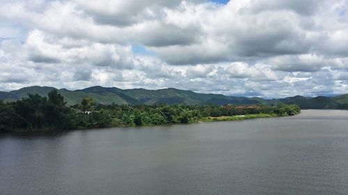 Scenic view of mountains against cloudy sky