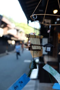 Close-up of electric lamp hanging in market