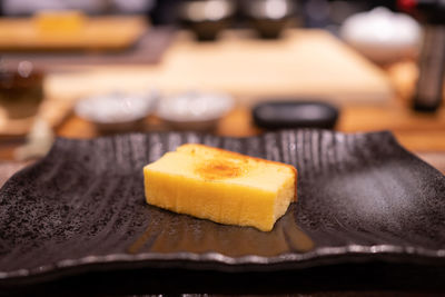 Tamago nigiri yaki or sweet egg sushi on the dish.