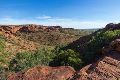 Scenic view of rocky mountains against blue sky