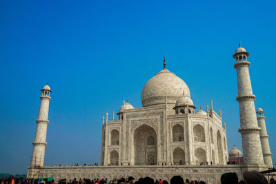 Low angle view of historical building against blue sky