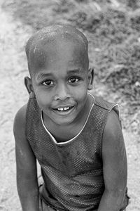 Portrait of young woman sitting at beach