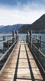 Pier over sea against sky