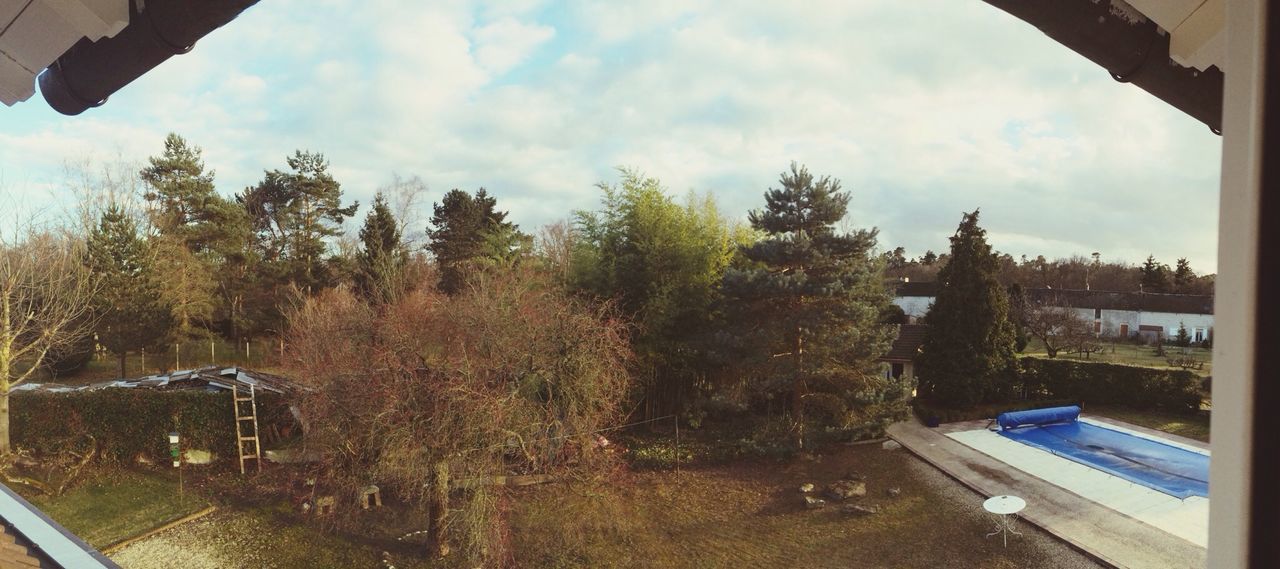 sky, tree, built structure, building exterior, architecture, cloud - sky, cloud, day, cloudy, outdoors, city, house, high angle view, nature, growth, no people, sunlight, residential structure, road, residential building