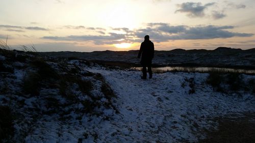 Scenic view of field against sky during sunset