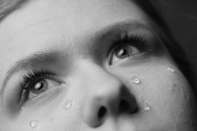 Close-up of woman face with teardrops