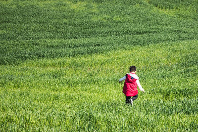 Full length of woman on field