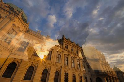 Low angle view of building against cloudy sky