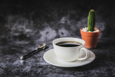 Close-up of coffee cup on table