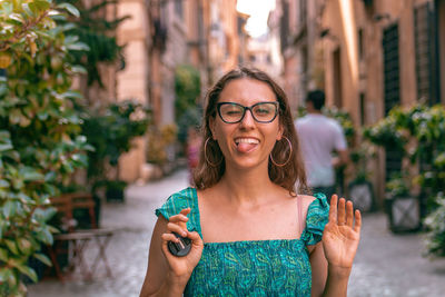 Tongue out, glasses, blink