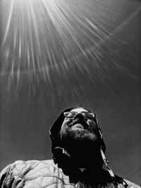 Low angle view of man looking at camera