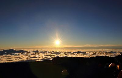 Scenic view of snow against sky during sunset