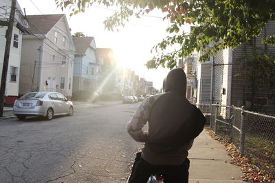 Rear view of man on street in city