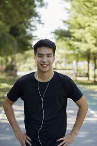 Portrait of young man standing outdoors