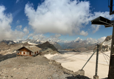 Panoramic view of houses and buildings against sky