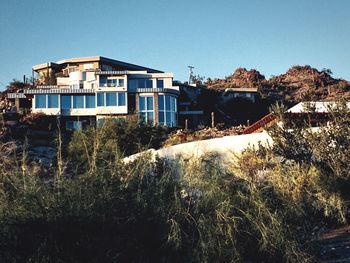 View of residential buildings against clear sky