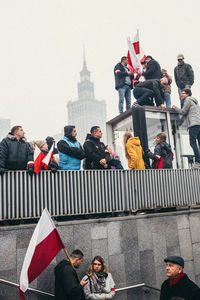 Group of people on building in city