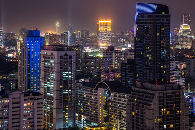 Illuminated modern buildings in city at night