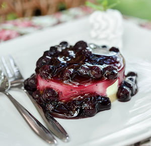 Piece of blueberry cheesecake on plate