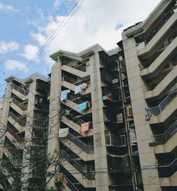 Low angle view of apartment buildings against sky