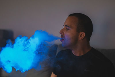 Portrait of young man smoking