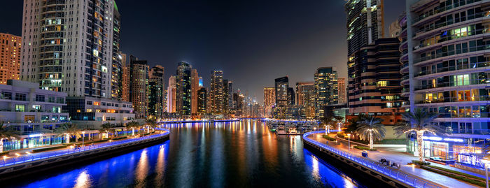 Illuminated buildings in city at night