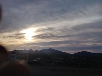 Scenic view of mountains against sky at sunset