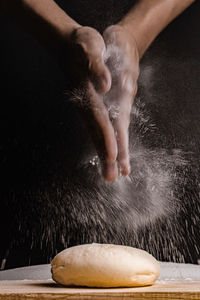 Close-up of hand preparing food