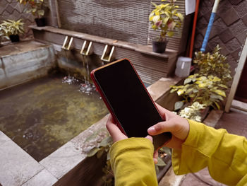 High angle view of person using mobile phone