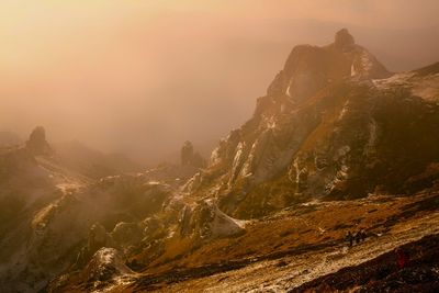 Aerial view of mountain against sky during sunset