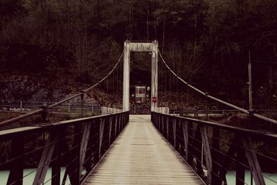 Empty footbridge at forest